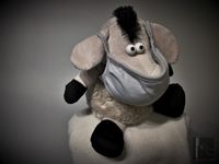 Donkey puppet wearing mask front view