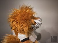 Goleo lion puppet wearing mask side view